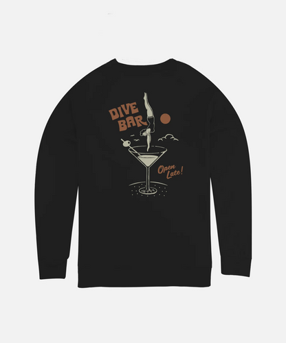 A  black long-sleeve crewneck sweatshirt by Jetty featuring a retro graphic on the front with a martini glass, a diver, the text 'DIVE BAR', and 'Open Late!' in a warm beige and orange color palette, shown against a light gray background.