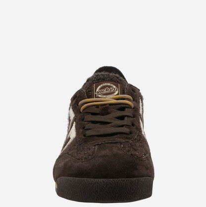 A dark brown suede Back 70 sneaker with a fuzzy brown collar, brown laces, and a circular brown 'Back 70' brand patch on the tongue, shown against a plain white background.