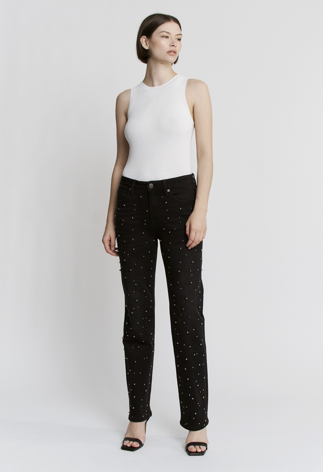 Black high‑rise pearl‑embellished jeans with soft‑stretch denim and slim leg.