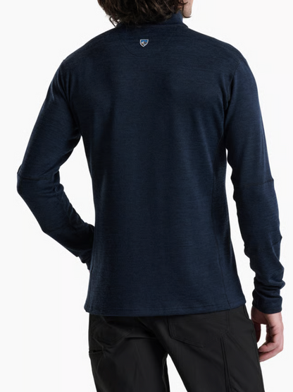 A man wearing a Kuhl Ryzer dark navy blue long-sleeve quarter-zip performance pullover, shown from the back against a clean white background.
