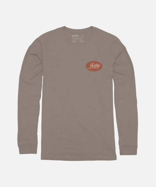 A long-sleeve crewneck t-shirt in a muted taupe-brown color, featuring the red and white 'Jetty' logo on the left chest, displayed on a clean light gray background.
