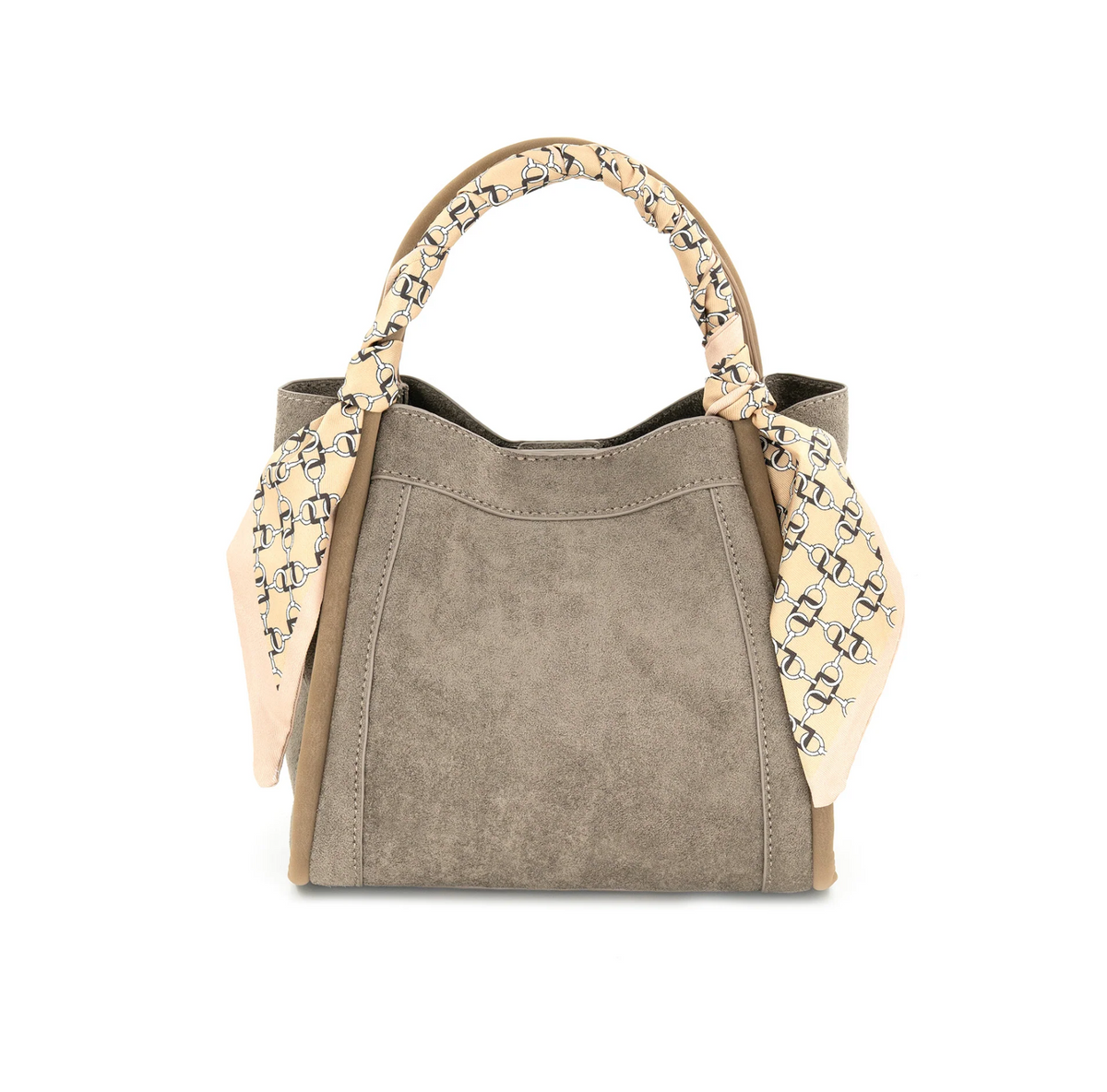 A structured handbag in taupe suede with tan leather trim and a beige silk scarf with a black geometric pattern tied around the top handle, shown on a plain white background.