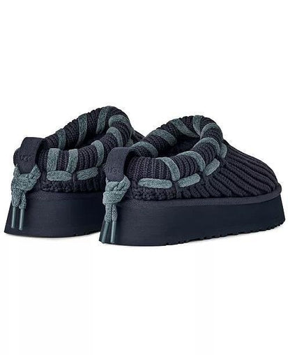 A pair of UGG Tazz Whipstitch dark navy knit slip-on slippers with thick platform soles and gray braided trim details, shown against a plain white background.
