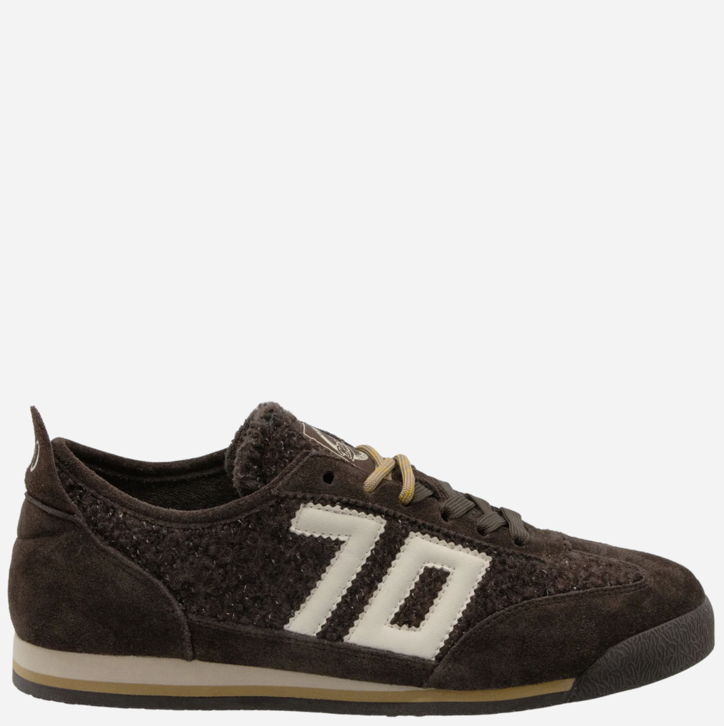 A dark brown suede and textured fabric low-top Back 70 sneaker with a large cream-colored '70' logo on the side, cream laces, and a cream midsole stripe, shown against a plain light gray background.