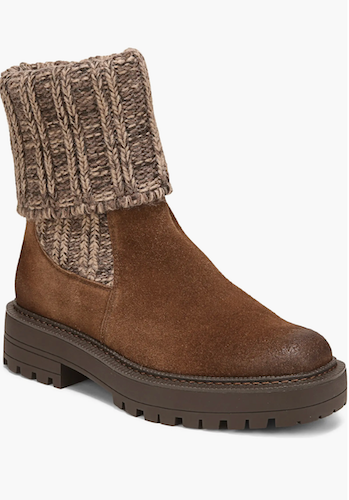 A Sam Edelman Laguna brown suede ankle boot with a chunky knit brown and beige cuff, set against a plain white background.