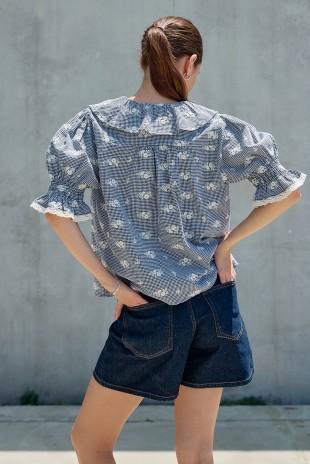 Raisonnel embroidered gingham blouse with lightweight woven fabric and relaxed, feminine silhouette.