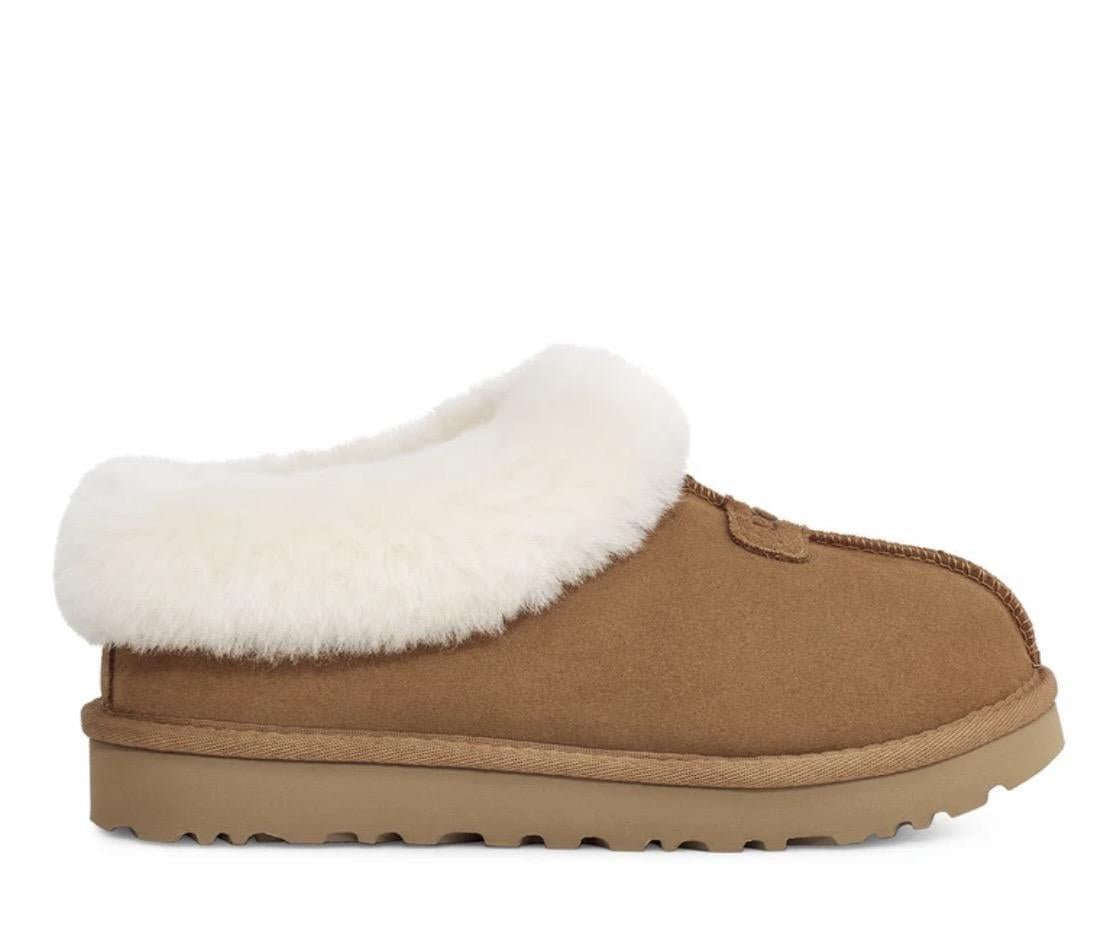 A single UGG slip-on clog shoe in tan suede with a thick white shearling collar and a tan rubber sole, shown from a side profile view on a white background.