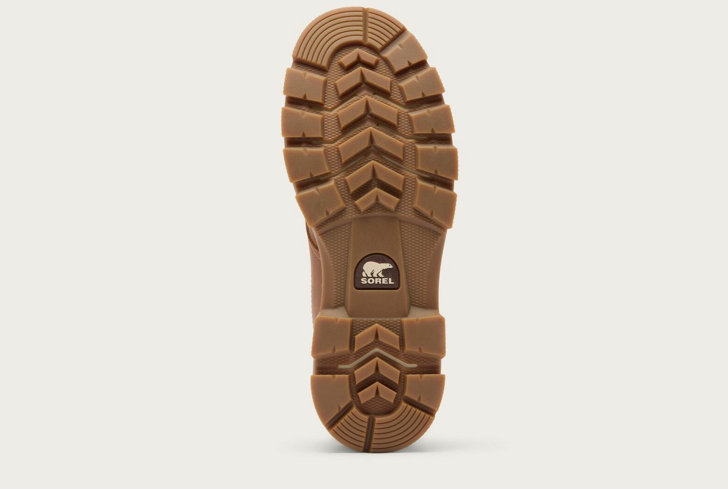 The tread of Sorel Lark‑47 men’s moc‑toe waterproof boot in velvet tan and tobacco with rugged traction outsole.