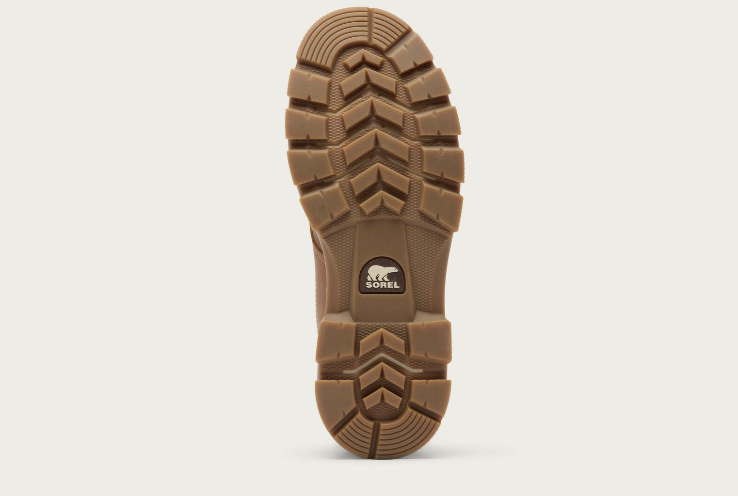 The tread of Sorel Lark‑47 men’s moc‑toe waterproof boot in velvet tan and tobacco with rugged traction outsole.