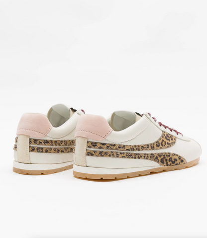 A pair of low-top Oncept sneakers shown from the side and back on a clean white background. The shoes are primarily off-white with a light pink heel tab, a leopard-print side stripe, and a gum sole.
