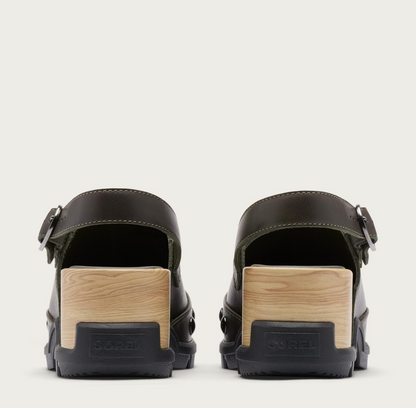 A pair of Sorel Roam’n dark olive green leather clogs with light wood block heels and black rubber soles, shown from the back on a light off-white background.