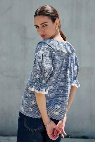 Raisonnel embroidered gingham blouse with lightweight woven fabric and relaxed, feminine silhouette.