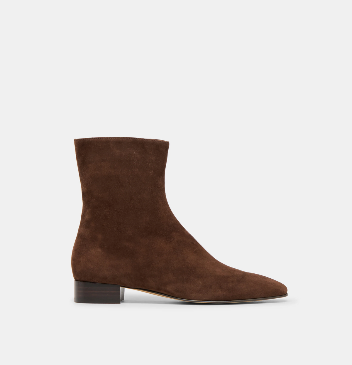 A single Dolce Vita Tarine brown suede ankle boot with a low block heel and pointed toe, shown in profile against a clean white background.