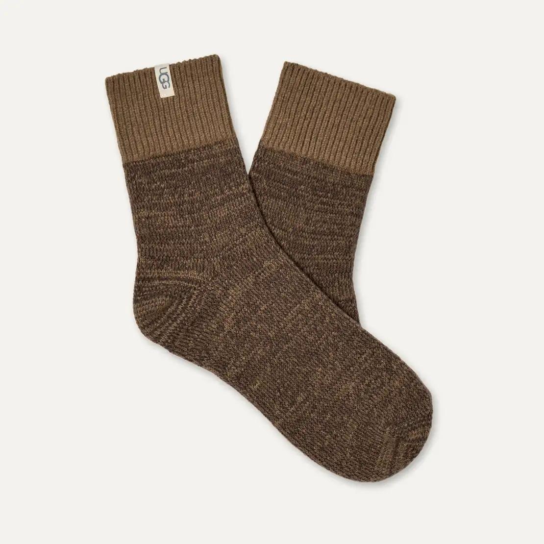 A pair of UGG Rib Knit Slouchy ankle socks in a heathered brown and tan color-blocked design, displayed on a clean off-white background.