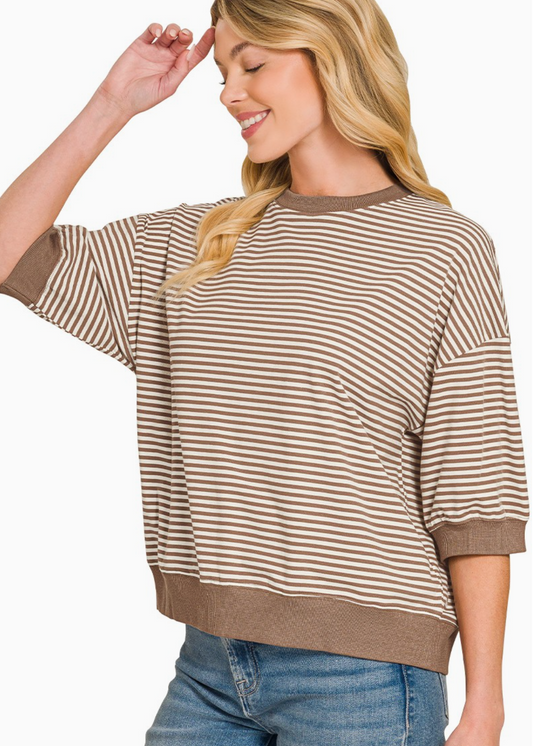Cream and mocha striped knit top with relaxed fit and classic crew neckline.