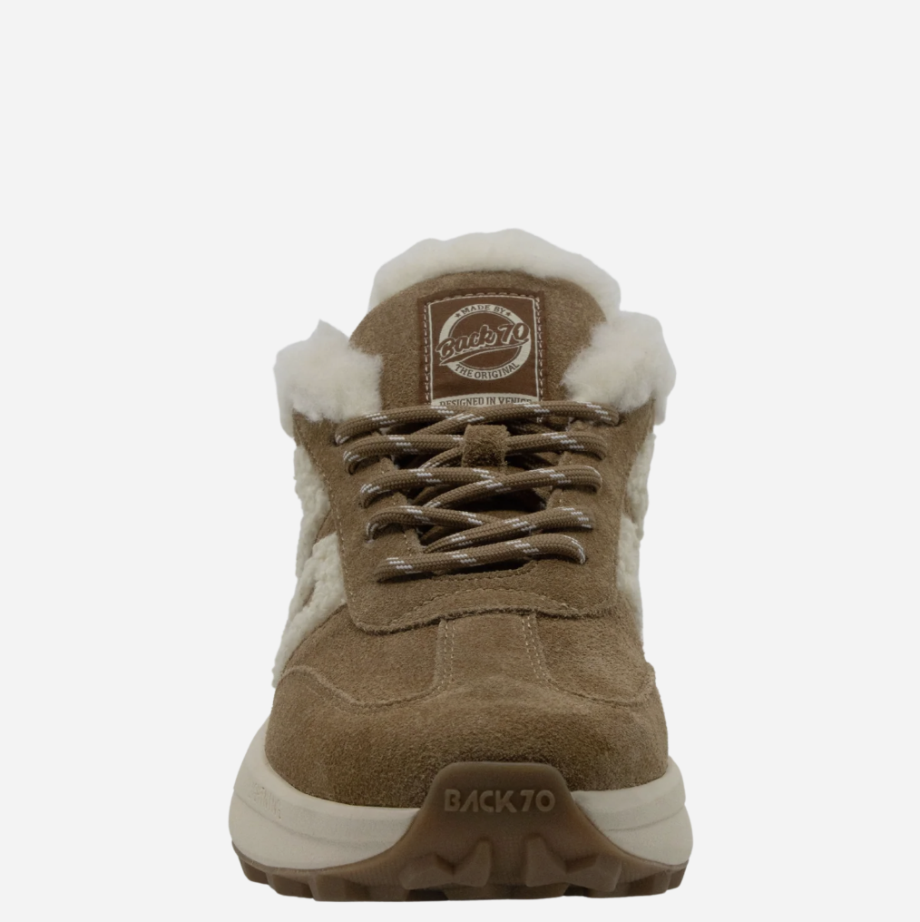 A single brown suede and faux-suede Back 70 mid-top sneaker with white shearling-style lining, brown laces, and a thick white and brown sole. The brand name 'BACK 70' is visible on the tongue patch and outsole.