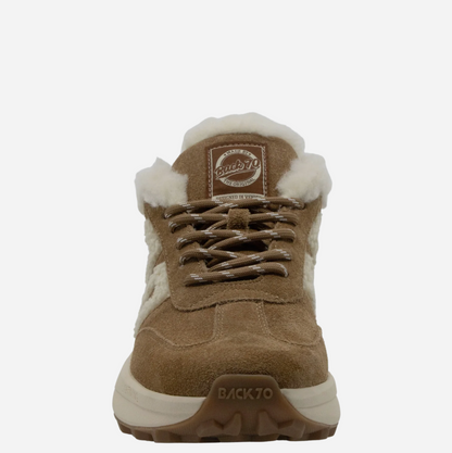 A single brown suede and faux-suede Back 70 mid-top sneaker with white shearling-style lining, brown laces, and a thick white and brown sole. The brand name 'BACK 70' is visible on the tongue patch and outsole.