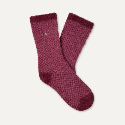 A pair of fuzzy, textured UGG Enlie crew socks in a deep burgundy or maroon color, displayed against a light off-white background.