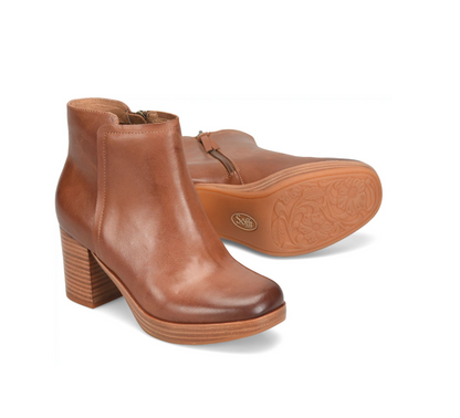 A pair of Sofft Kendall tan leather ankle boots with chunky block heels, shown on a clean white background. One boot is positioned upright to show the side and front, while the other lies on its side to display the sole with an embossed floral pattern and a visible 'SOF' logo.
