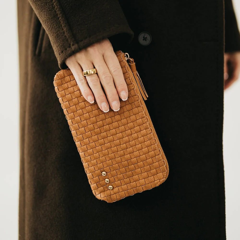 Brown woven clutch wristlet with slim silhouette and detachable wrist strap.