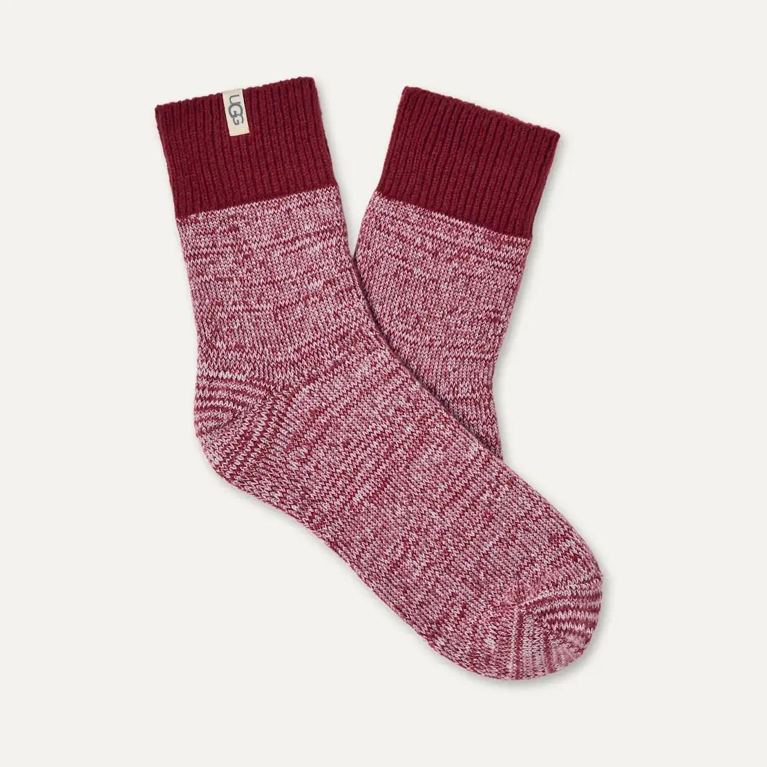 A pair of UGG Rib Knit Slouchy Quarter socks with a marled burgundy and pink body and solid dark burgundy ribbed cuffs, displayed on a light off-white background.
