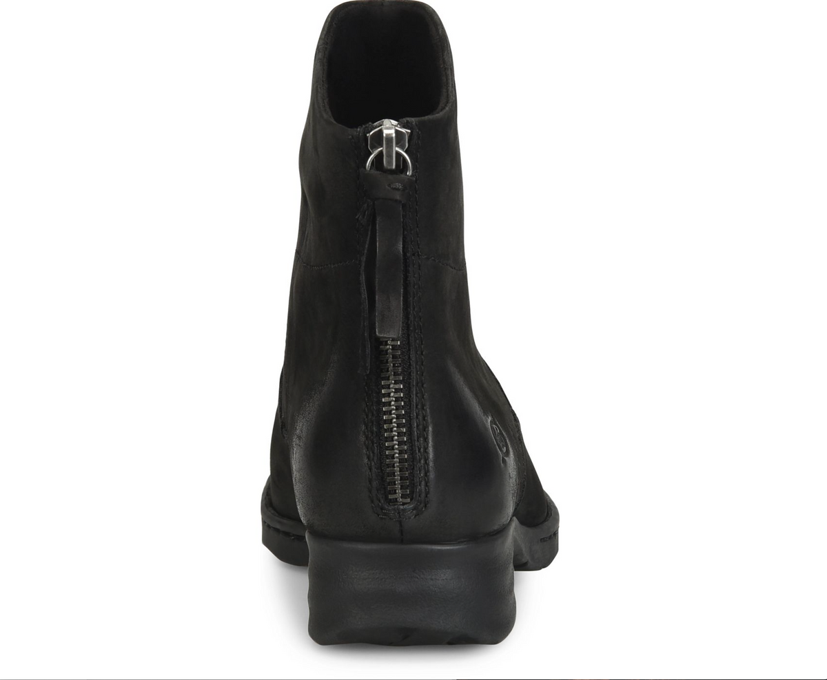 A Born Mercado black leather ankle boot shown from the back, featuring a side zipper with a silver metal pull tab and a low block heel, set against a plain white background.