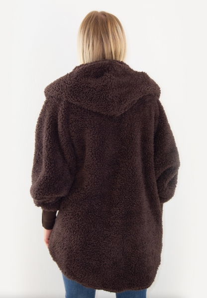 Back view of a Nordic Beach Brown wrap worn by a woman on a white background