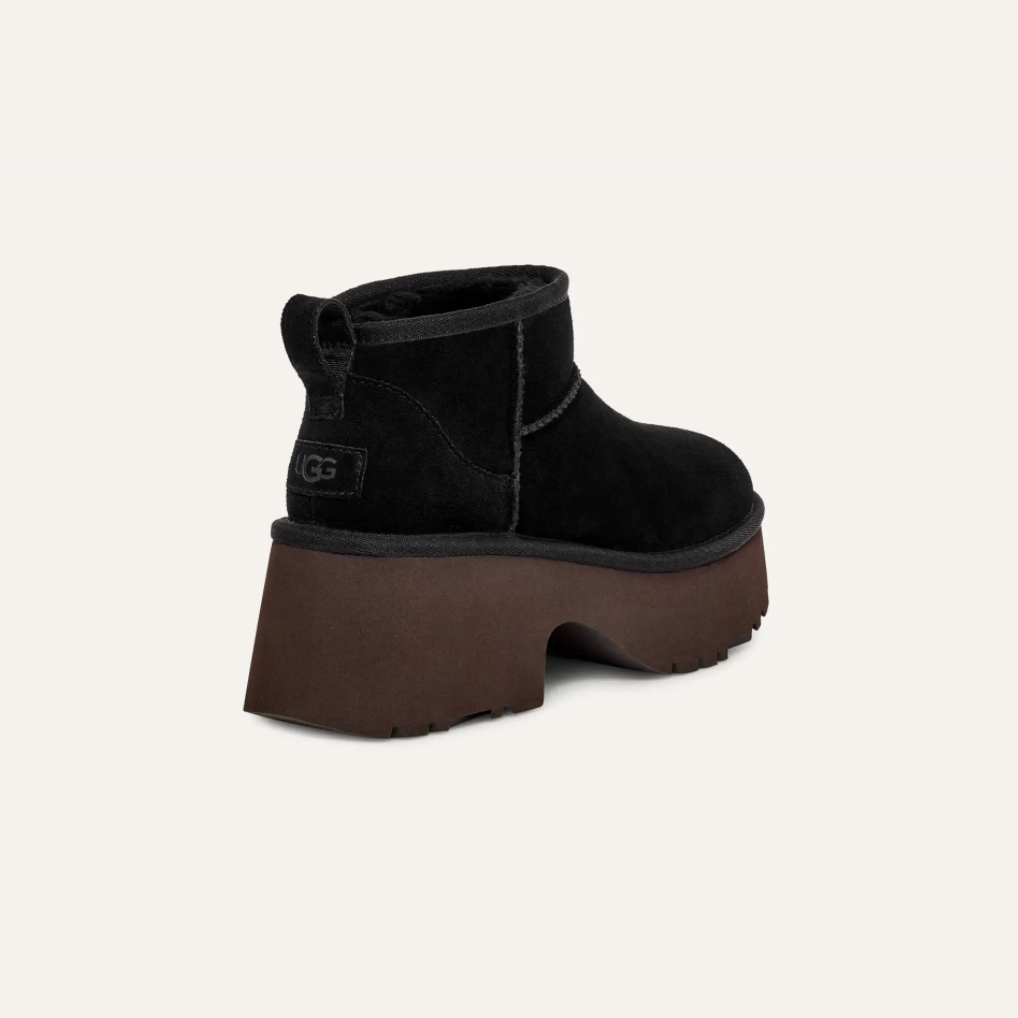 Women’s UGG Classic Ultra Mini New Heights boot in black suede with UGGplush lining and a chunky platform sole.
