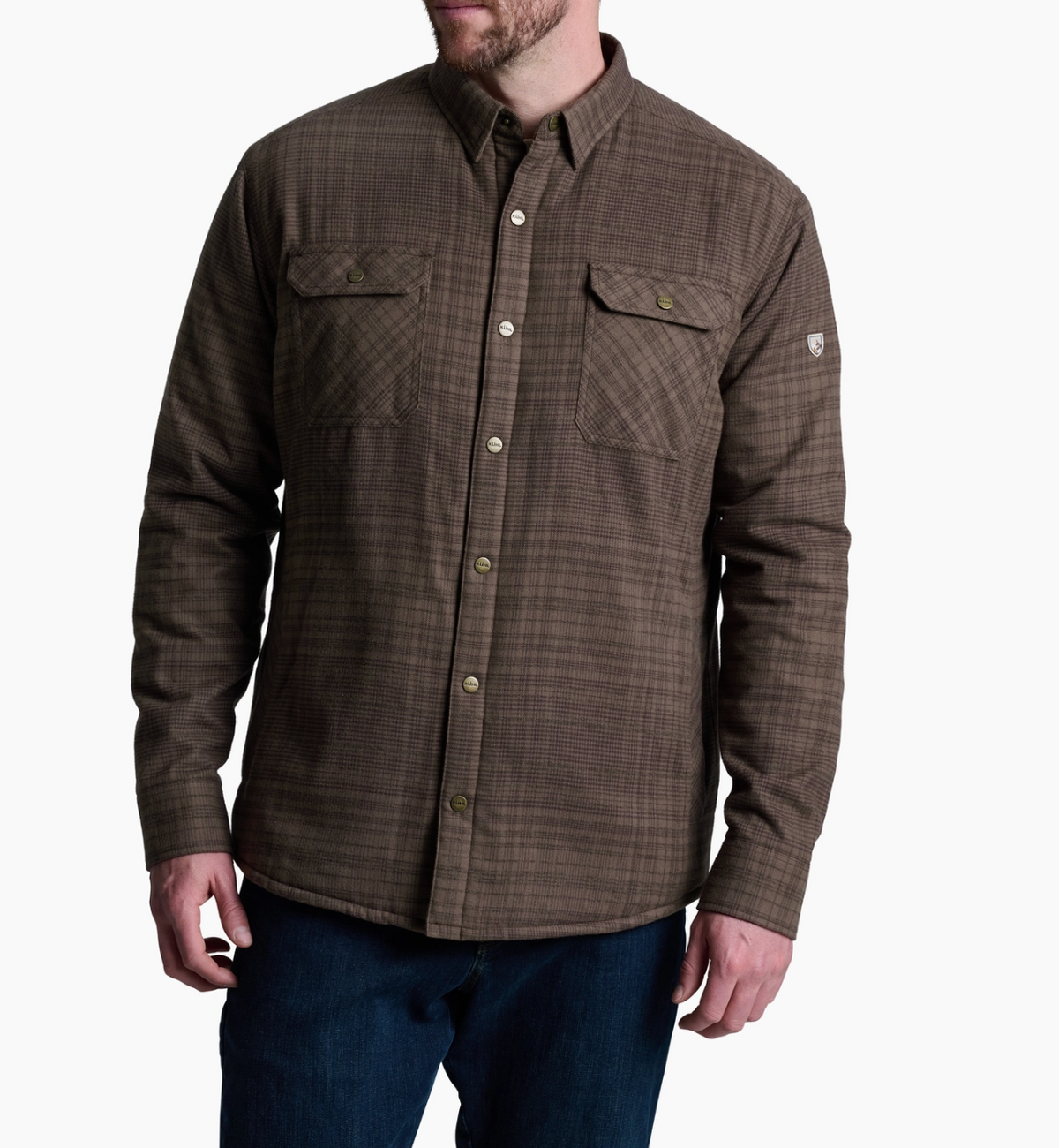 Kuhl Joyridr Brown plaid shirt worn by a person on a white background